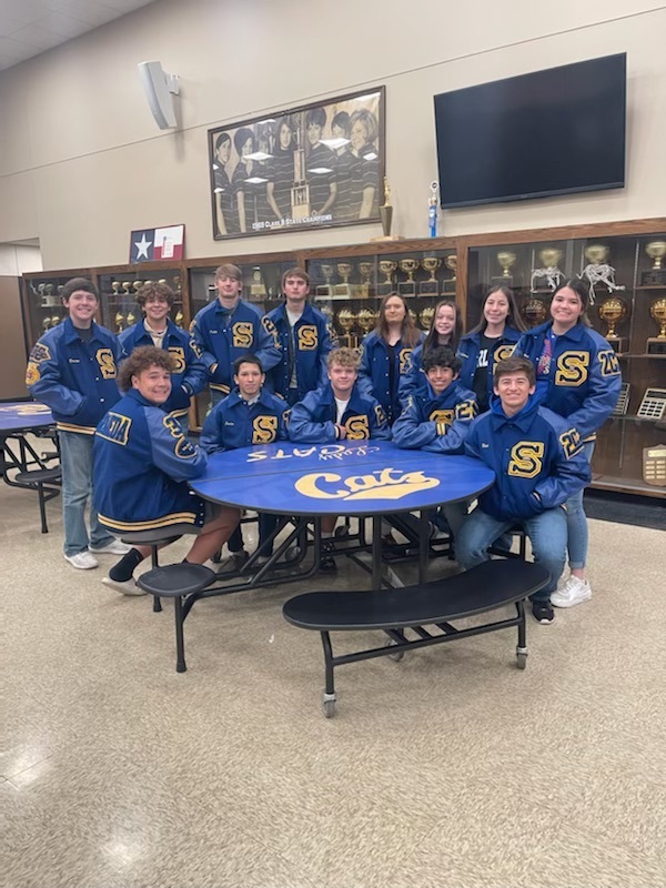 hs students with their new letter jackets 