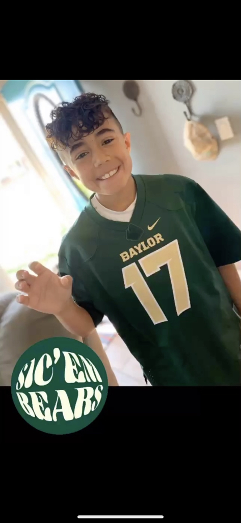 Student wearing his favorite college jersey 